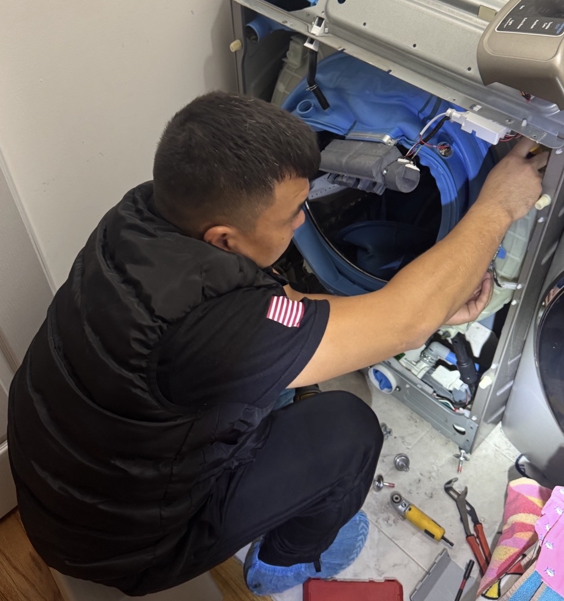 Badma repairing GE washer — Premier Appliance Repair serving Tottenville Staten Island 10307 near Main St and Amboy Rd