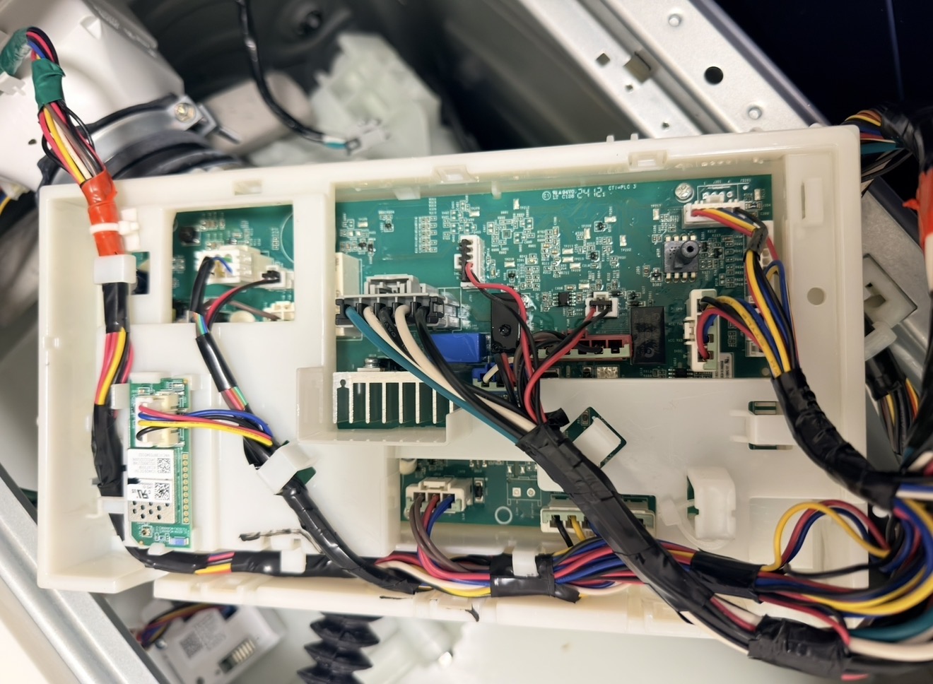 GE washer internal wiring and control board exposed — inlet valve and electrical diagnosis in New Dorp Staten Island 10306